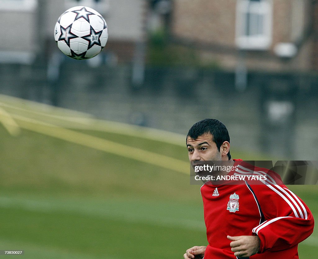 Liverpool's Javier Mascherano attends a...