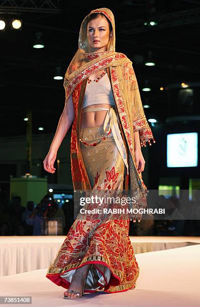 Dubai, UNITED ARAB EMIRATES: A model presents the work of Indian fashion designer Manish Malhotra during 'The Bride Show' in the Gulf emirate of...