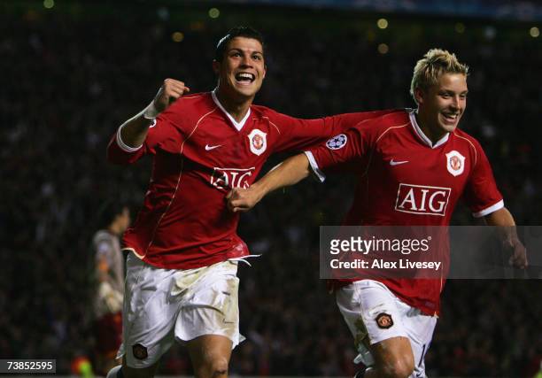 Cristiano Ronaldo of Manchester United celebrates scoring his team's fifth goal with team mate Alan Smith during the UEFA Champions League Quarter...