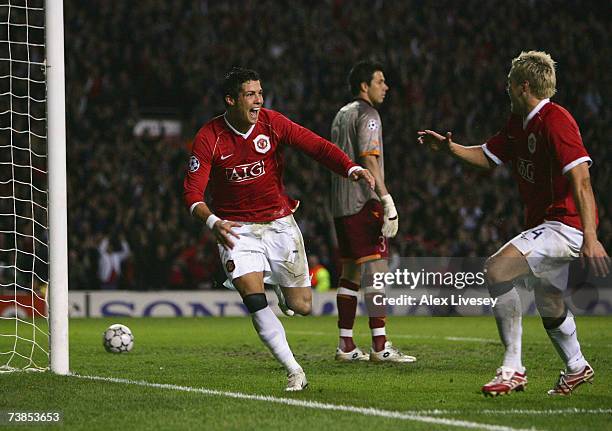 Cristiano Ronaldo of Manchester United celebrates scoring his team's fifth goal with team mate Alan Smith during the UEFA Champions League Quarter...