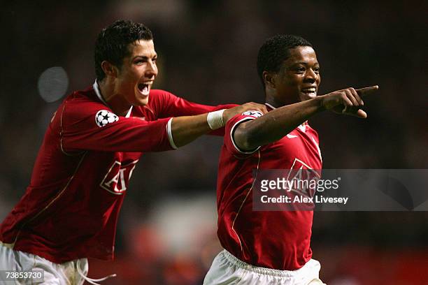 Patrice Evra of Manchester United celebrates scoring his team's seventh goal with team mate Cristiano Ronaldo during the UEFA Champions League...