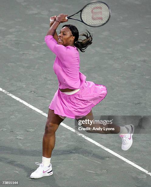 Serena Williams hits a return during her match against Yung-Jan Chan of Chinese Taipei during the Family Circle Cup at the Family Circle Tennis...