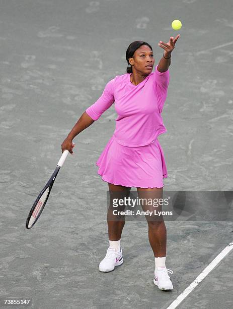 Serena Williams hits a serve during her match against Yung-Jan Chan of Chinese Taipei during the Family Circle Cup at the Family Circle Tennis Center...