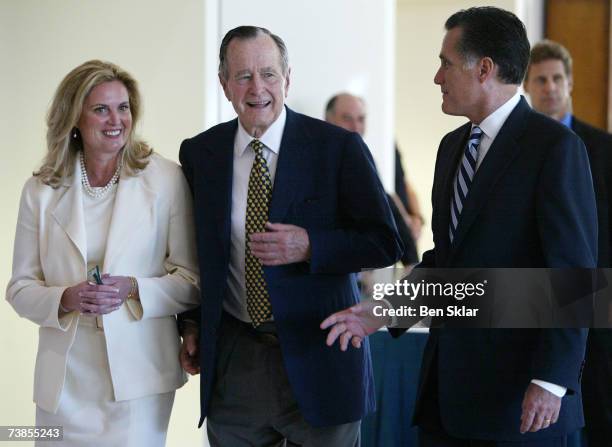 Former Governor of Massachusetts and 2008 Republican presidential hopeful Mitt Romney walks with his wife Ann and former U.S. George H.W. Bush at the...