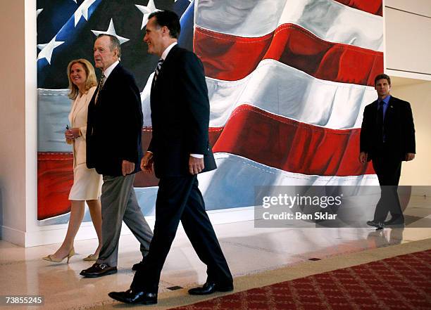 Former Governor of Massachusetts and 2008 Republican presidential hopeful Mitt Romney walks with his wife Ann and former U.S. George H.W. Bush at the...