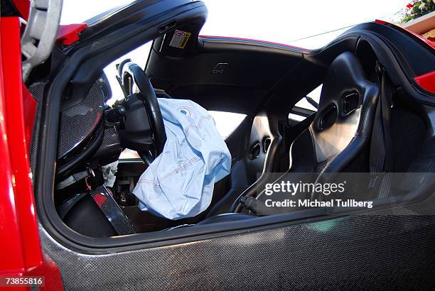 The deployed airbag inside the remains of an Enzo Ferrari previously wrecked by actor Eddie Griffin, at a memorial service held for the car in the...