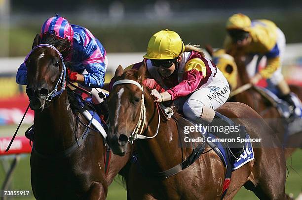 Corey Brown riding Tor's Dancer and Kathy O'Hara riding Matilda Princess come down the straight in the EQUAL Handicap during the Australian Oaks Day...