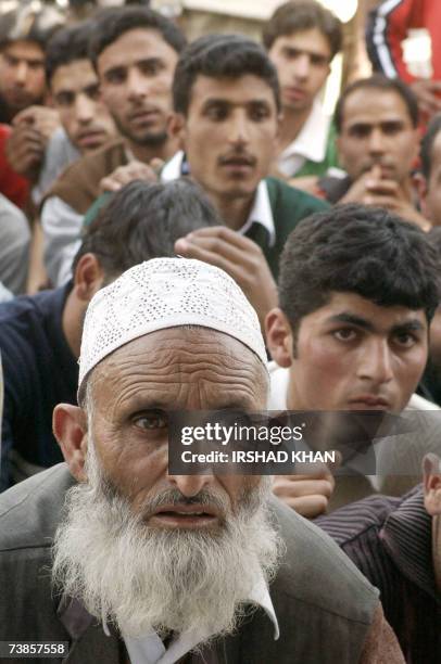 Party supporters listen to speeches during a welcoming ceremony for senior separatist leader and chairman of the Jammu and Kashmir National Front ,...