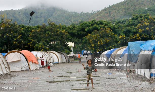 An East Timorese girl flies a kite in a refugee camp on April 11, 2007 in Dili, East Timor. East Timor's two top candidates are Nobel prize-winner...