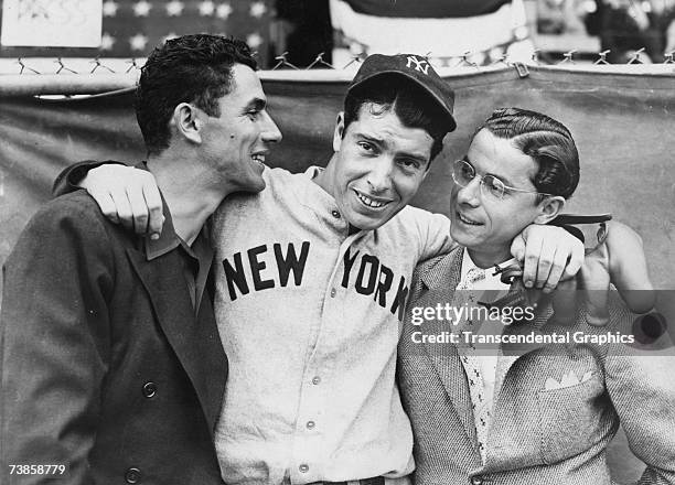 Rookie Joe DiMaggio, center, hugs his brothers Vince, left, and Dom, before the start of the 1936 World Series in New York in October.