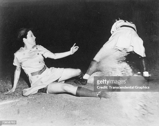 Dorothy Kamenshek of the Rockford Peaches of the AAGBL slides safely into third during a league game in 1946.