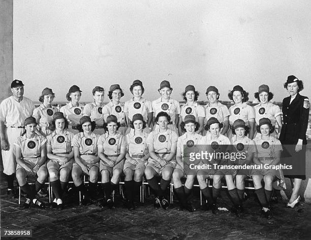 The Rockford Peaches of the All American Girls Baseball League pose for a team portrait at home in 1944.