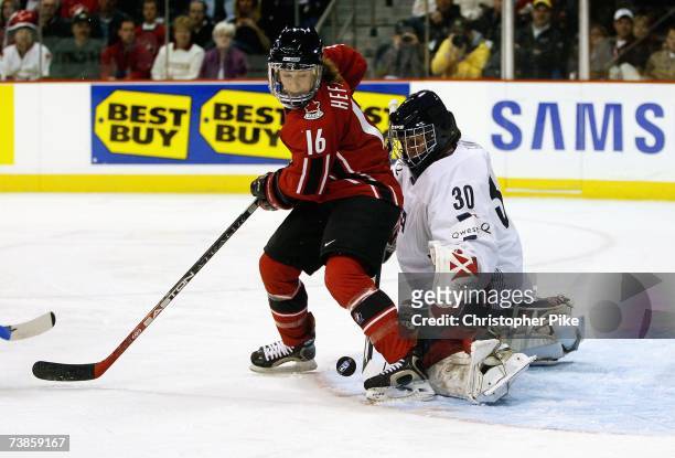 Jayna Hefford of Canada screens goalie Chanda Gunn of the USA in the first period of the IIHF Women's World Championship Gold Medal game on April 10,...