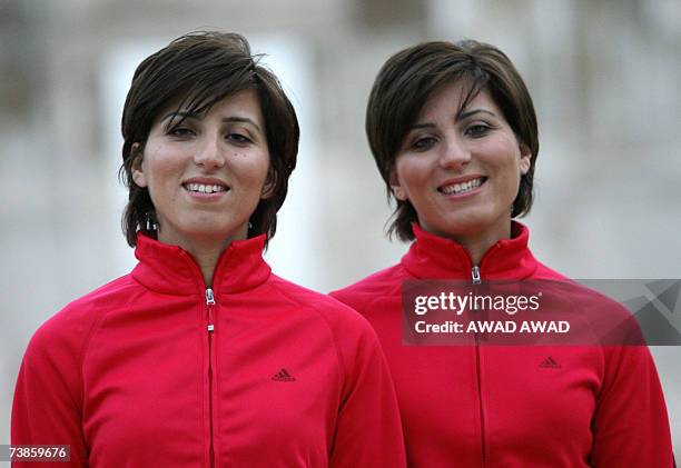 Twenty-six year old Jordanian twins Dima and Lama Hattab train in Amman, 23 March 2007. Experienced marathon runners, the women have turned to...