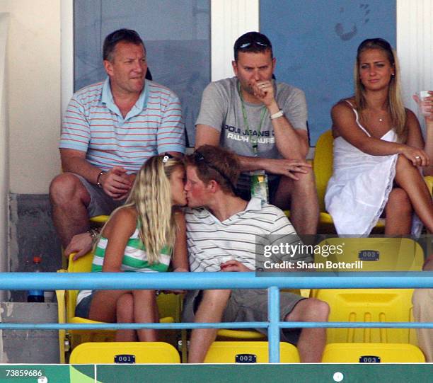 Prince Harry kisses girlfriend Chelsy Davy as they watch the action during the ICC Cricket World Cup 2007 Super Eight match between England and...