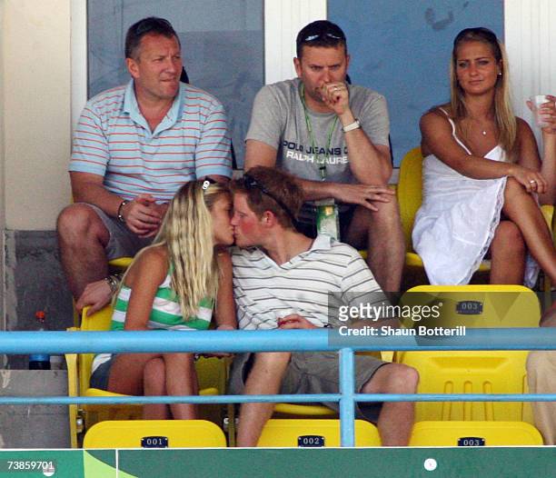 Prince Harry kisses girlfriend Chelsy Davy as they watch the action during the ICC Cricket World Cup 2007 Super Eight match between England and...