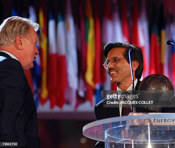 Indian representative, Jyoti Prasad Painuly, , receives an Energy Globe award, Fire Category, from Hollywood star Martin Sheen, , during the Energy...