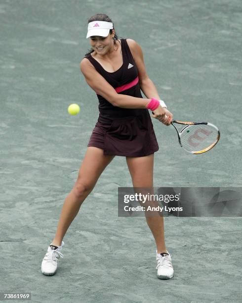 Ana Ivanovic of Serbia hits a return in her 6-0, 6-7 , 6-4 victory over Gisela Dulko of Argentina during the Family Circle Cup at the Family Circle...