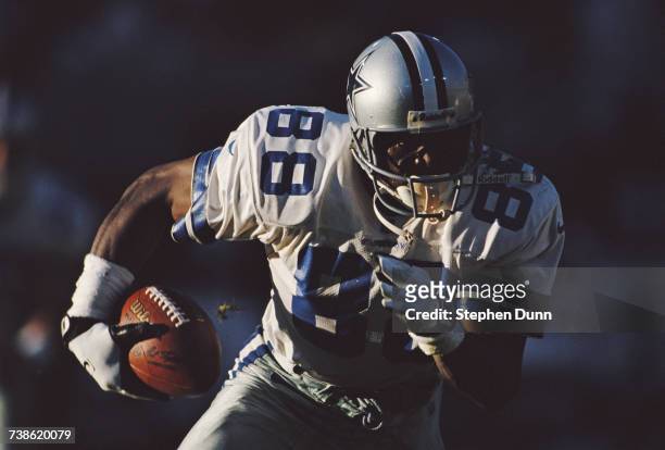 Michael Irvin, wide receiver for the Dallas Cowboys carries the ball during the National Football Conference game against the Phoenix Cardinals on 8...
