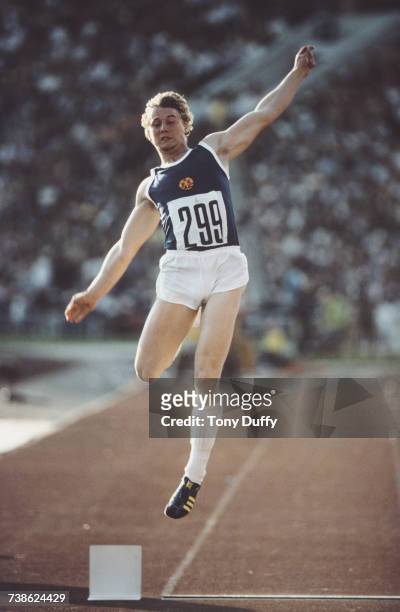 Lutz Dombrowski of East Germany leaps into the air during the Men's Long Jump event at the XXII Olympic Summer Games on 28 July 1980 at the Grand...