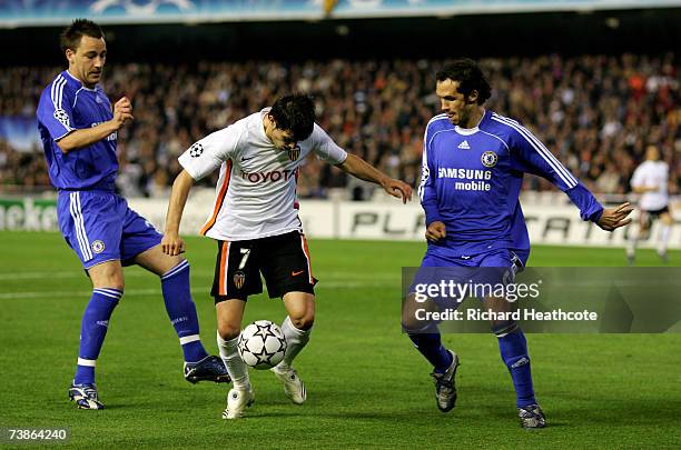 David Villa of Valencia is challenged by John Terry and Ricardo Carvalho of Chelsea during the UEFA Champions League Quarter Final 2nd leg match...