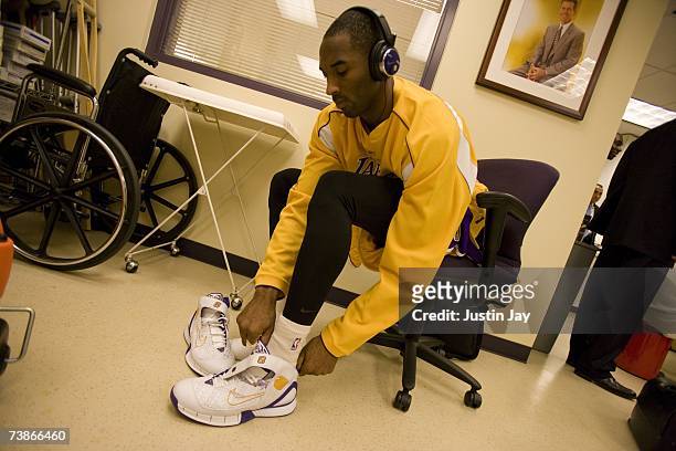 Kobe Bryant puts on his shoes before Lakers game at the Staples Center, Los Angeles, California.