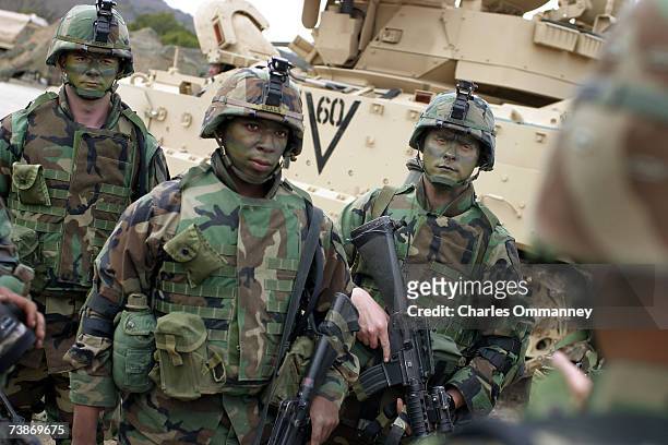 Members of the US Army's 1st Battalion 5th Cavalry regiment using the tactical internet or FBCB2 system whilst training on February 12, 2003 in Ft...