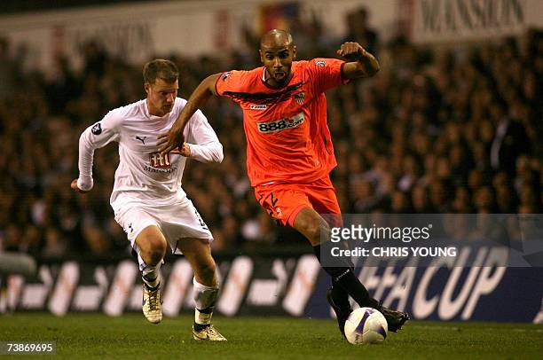 London, UNITED KINGDOM: Sevilla's former Tottenham striker Freddie Kanoute takes on Tottenham's Teemu Tainio during their UEFA Cup quarter-final tie...
