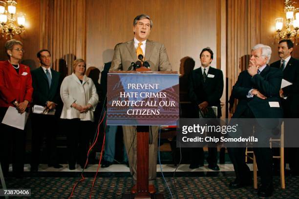 With members of law enforcement and human rights organizations, Sen. Gordon Smith speaks during a news conference at the U.S. Capitol April 12, 2007...