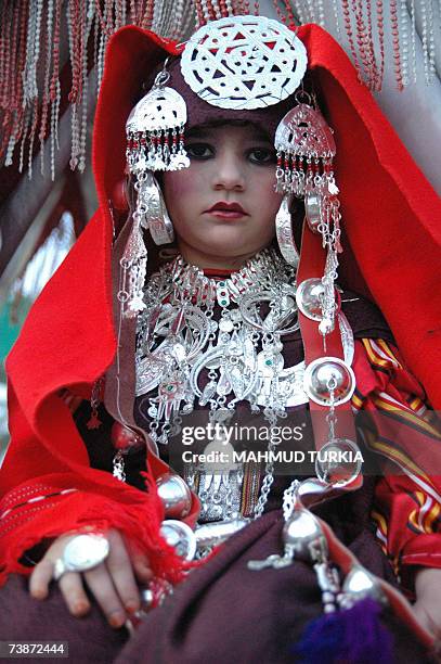 Tripoli, LIBYAN ARAB JAMAHIRIYA: A Libyan young girl dressed in traditional clothing poses during celebrations to mark the Libyan capital Triploi as...