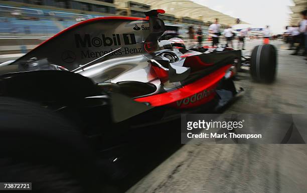 Fernando Alonso of Spain and McLaren Mercedes drives back to the garage during practice for the Bahrain Formula One Grand Prix at the Bahrain...