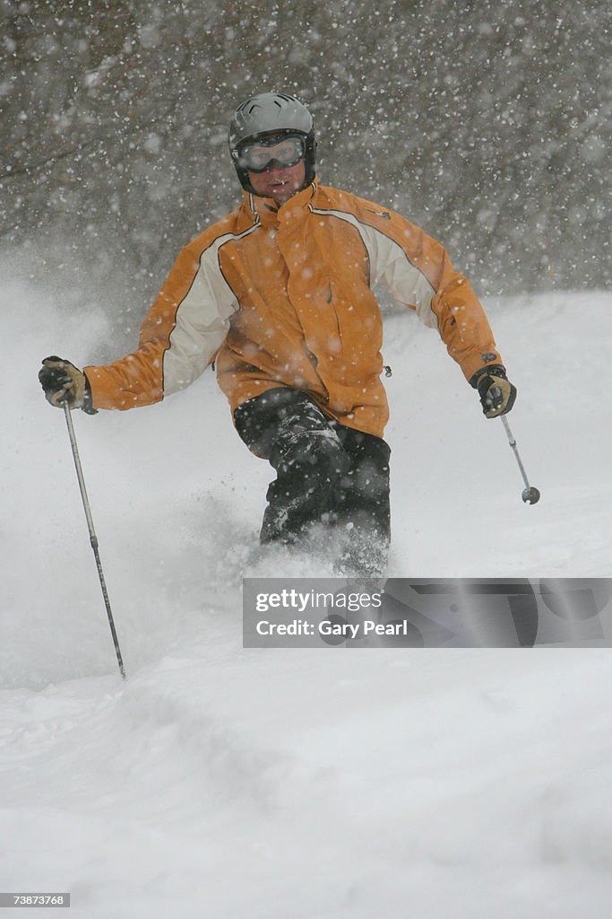 Man skiing in snow storm