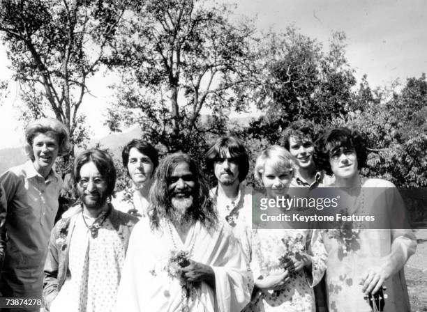 Maharishi Mahesh Yogi with members of the Beatles and other famous followers, who have chosen to study transcendental meditation at his academy in...