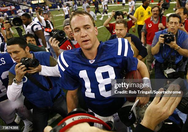 Quarterback Peyton Manning of the Indianapolis Colts looks on after a game against the New England Patriots during the AFC Championship game on...