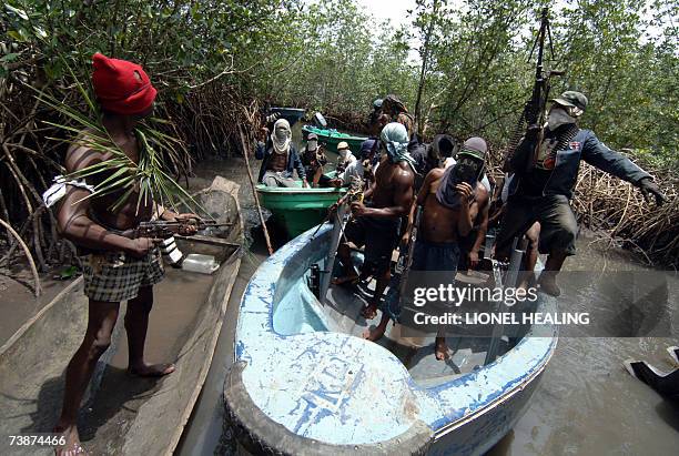 Ateke Tom militants arrive by boat at their camp, 13 April 2007, in Okrika, Rivers State. Ateke Tom is the leader of the Niger Delta Vigilante, an...