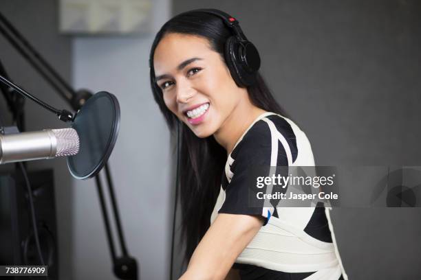 Smiling Thai transgender woman at microphone