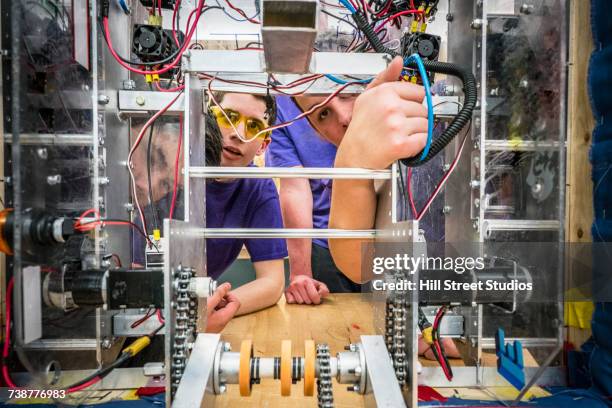 caucasian boys wiring robotics in school - electronics engineering students stock pictures, royalty-free photos & images