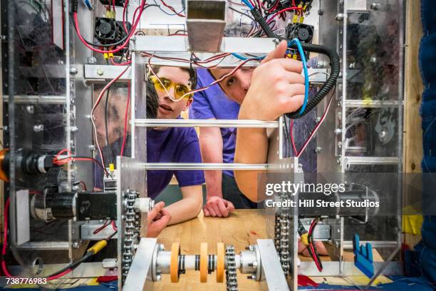 caucasian boys wiring robotics in school - unity school stock pictures, royalty-free photos & images