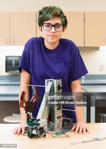 native american girl posing with robotics at school - working girl stock pictures, royalty-free photos & images