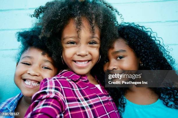 portrait of smiling girls - cute girl hairstyles family stock pictures, royalty-free photos & images