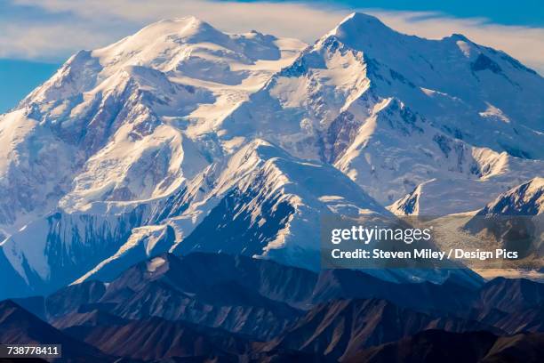 denali towers above surrounding mountain ridges in denali national park and preserve - mt mckinley stock pictures, royalty-free photos & images