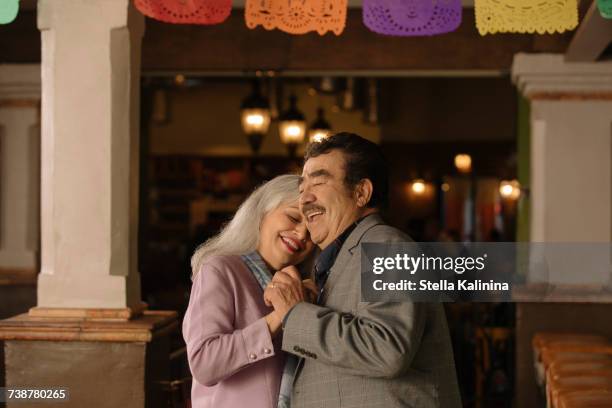 older couple dancing in restaurant - old couple restaurant stock pictures, royalty-free photos & images