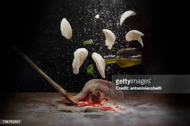 pizza ingredients - food mid air stock pictures, royalty-free photos & images