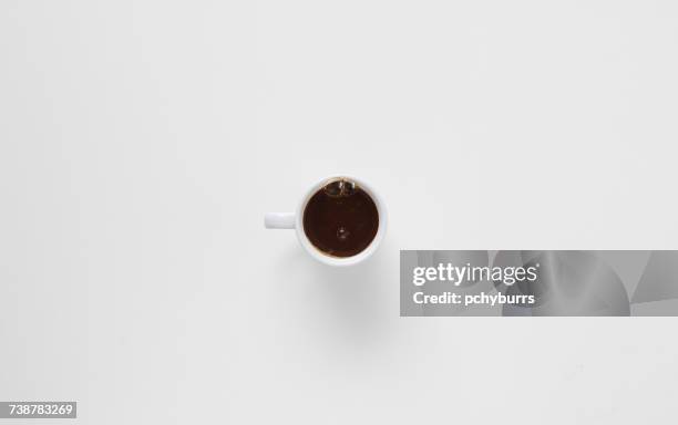 bubbles making an anthropomorphic face in a cup of coffee - pchyburrs stock pictures, royalty-free photos & images