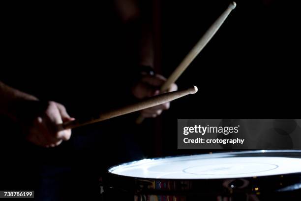percussionist playing drums in a recording studio - drumstick stock pictures, royalty-free photos & images