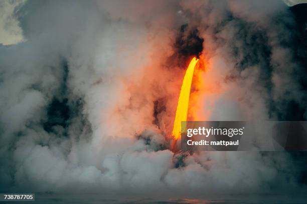 lava flowing from a lava tube into pacific ocean, hawaii, america, usa - lava tube stock pictures, royalty-free photos & images