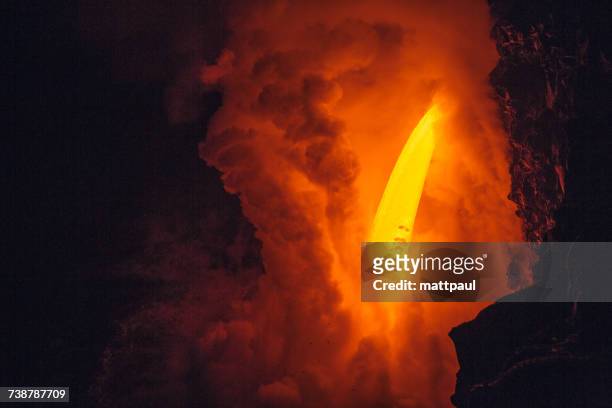 close-up of lava flowing from a lava tube into pacific ocean, hawaii, america, usa - lava tube stock pictures, royalty-free photos & images