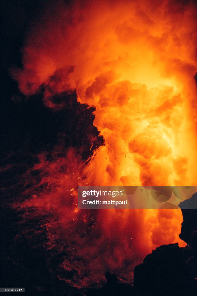 Close-up Lava flowing from a lava tube into Pacific ocean, Hawaii, America, USA