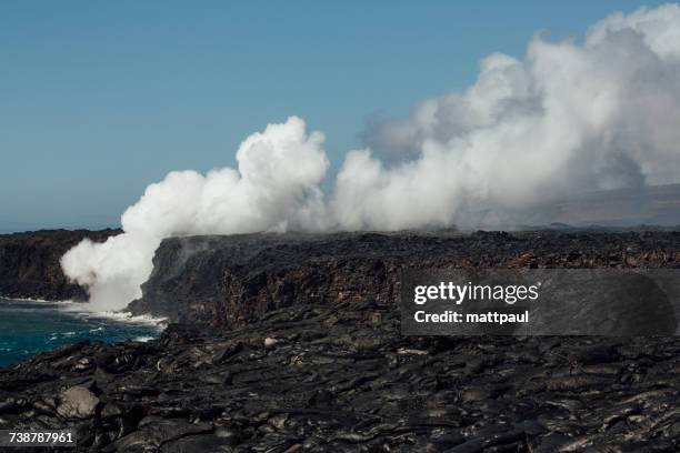 lava flowing into pacific ocean, hawaii, america, usa - lava tube stock pictures, royalty-free photos & images