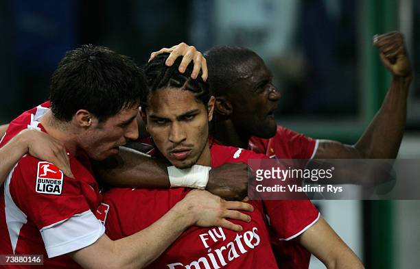 Paolo Guerrero of Hamburg is celebrated by his team mates after scoring a goal during the Bundesliga match between Borussia Monchengladbach and...